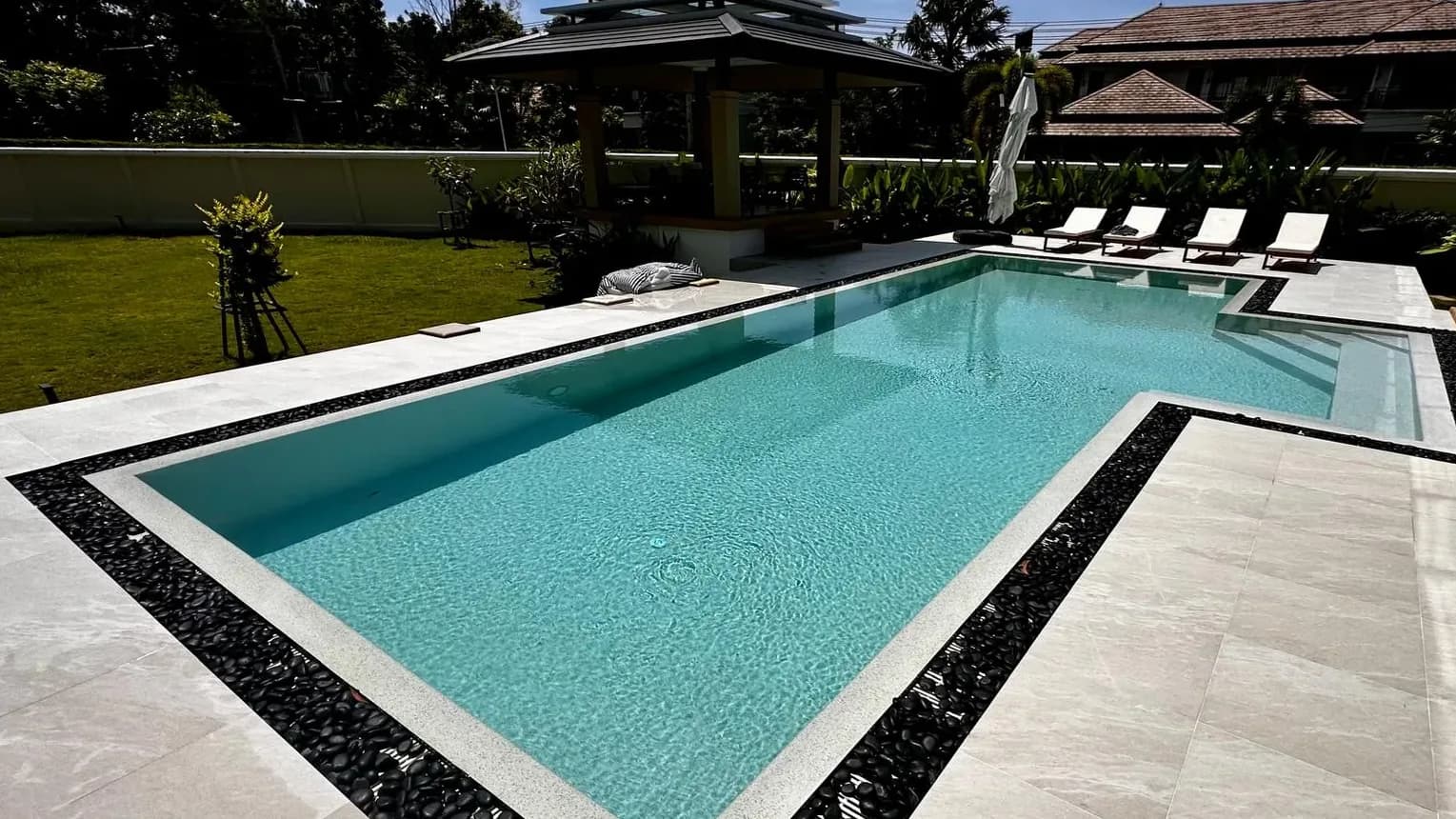 L-shaped garden pool after renovation