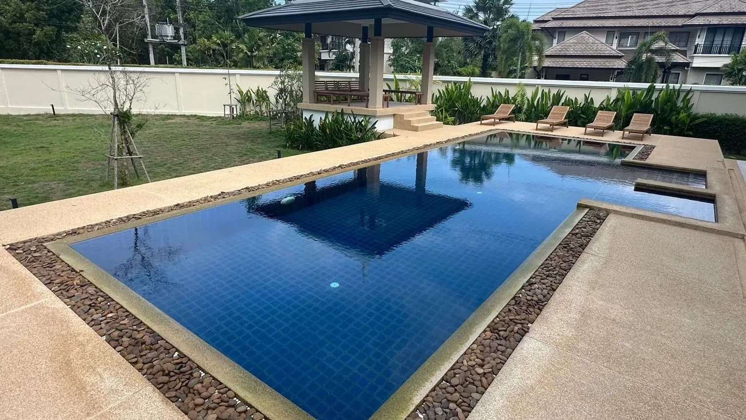 L-shaped garden pool before renovation