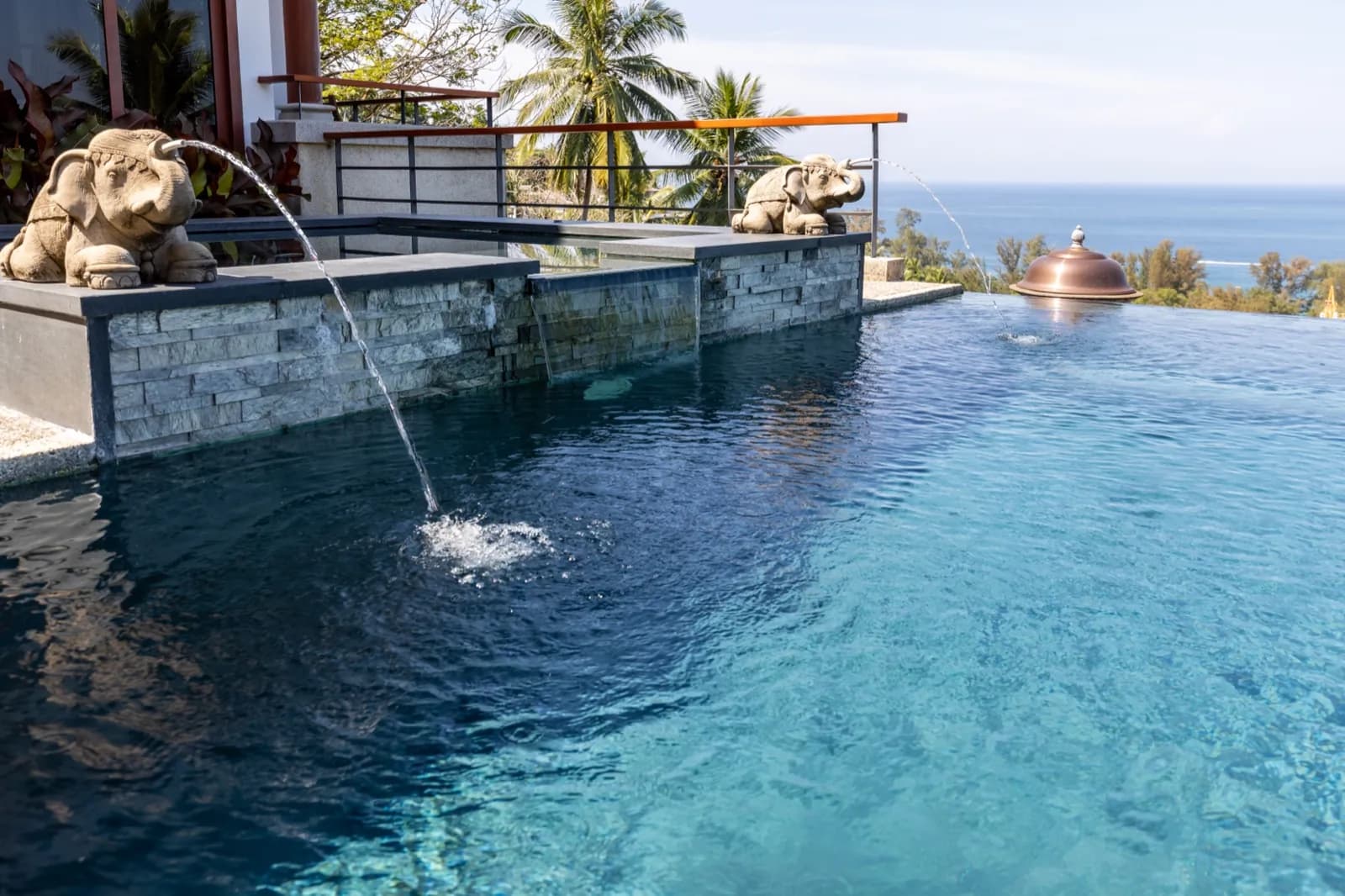 Close view of shimmering dark blue water over a deep-toned pebble finish